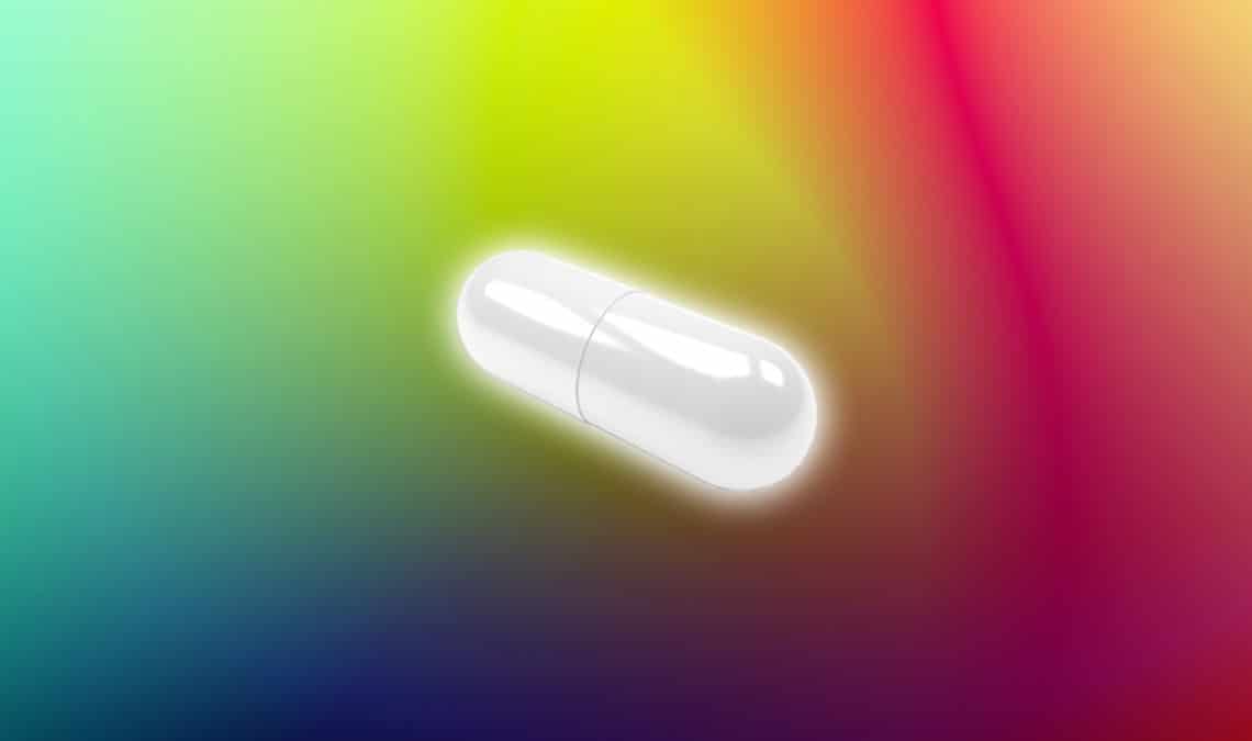 White capsule over colorful gradient