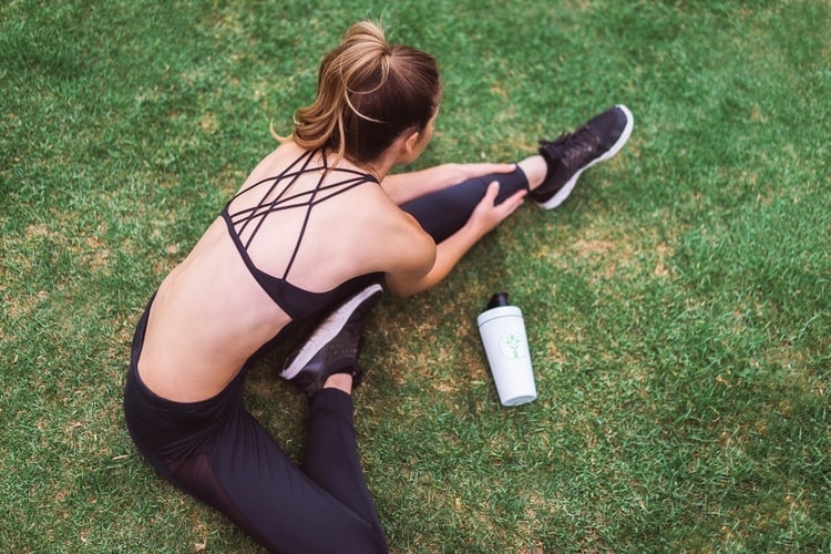 woman stretching before workout