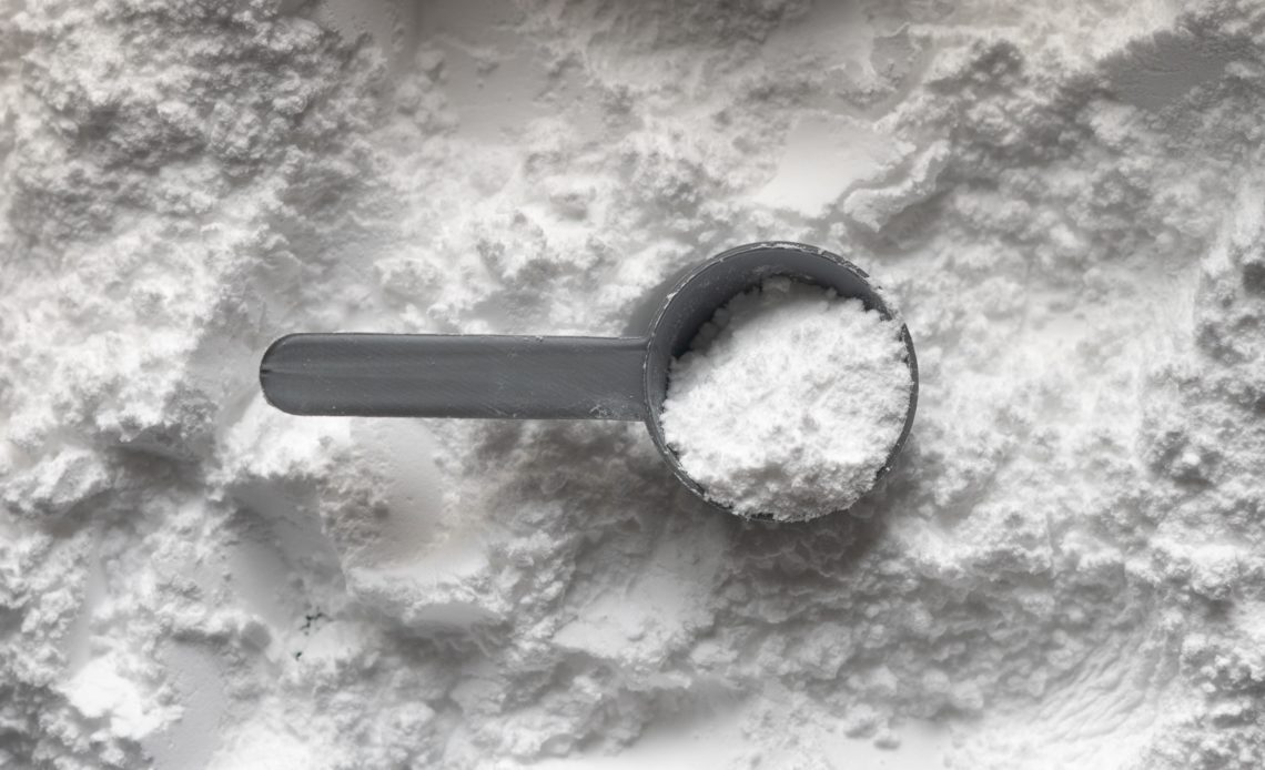 white powder in gray scoop