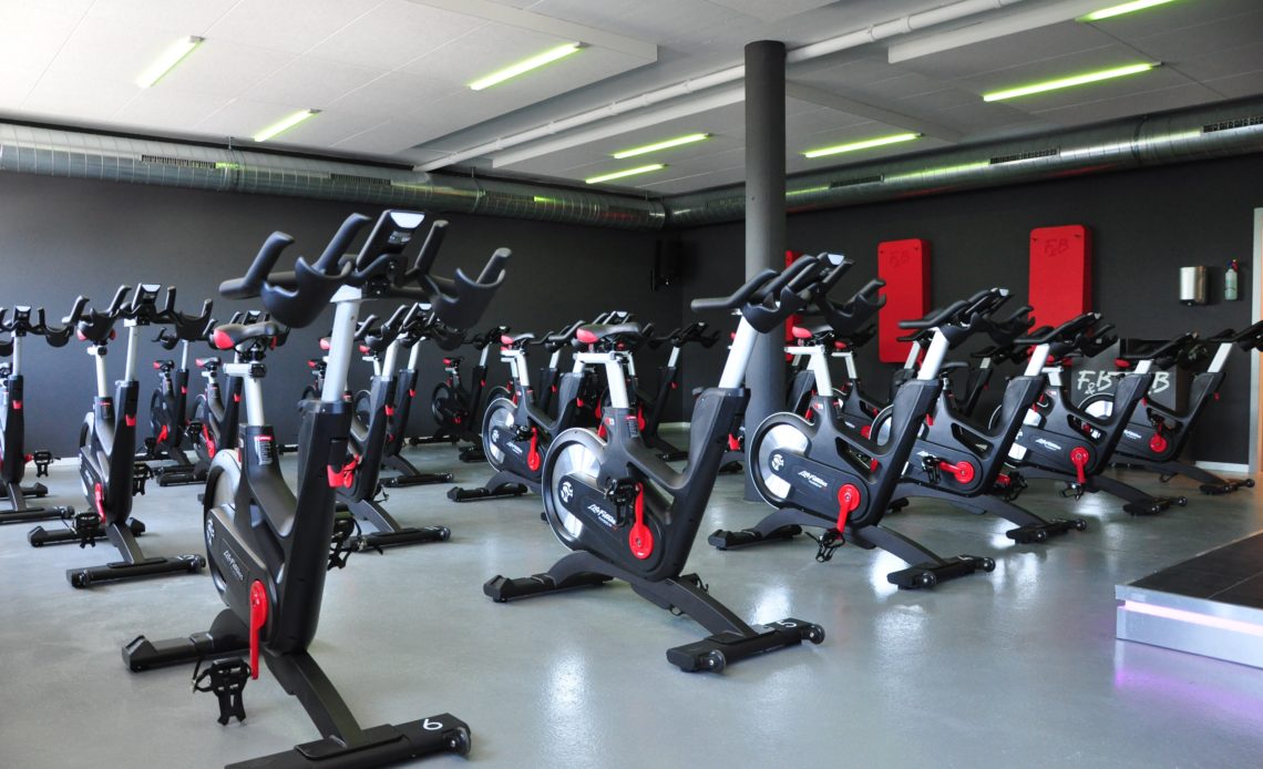 multiple spin bikes in training room