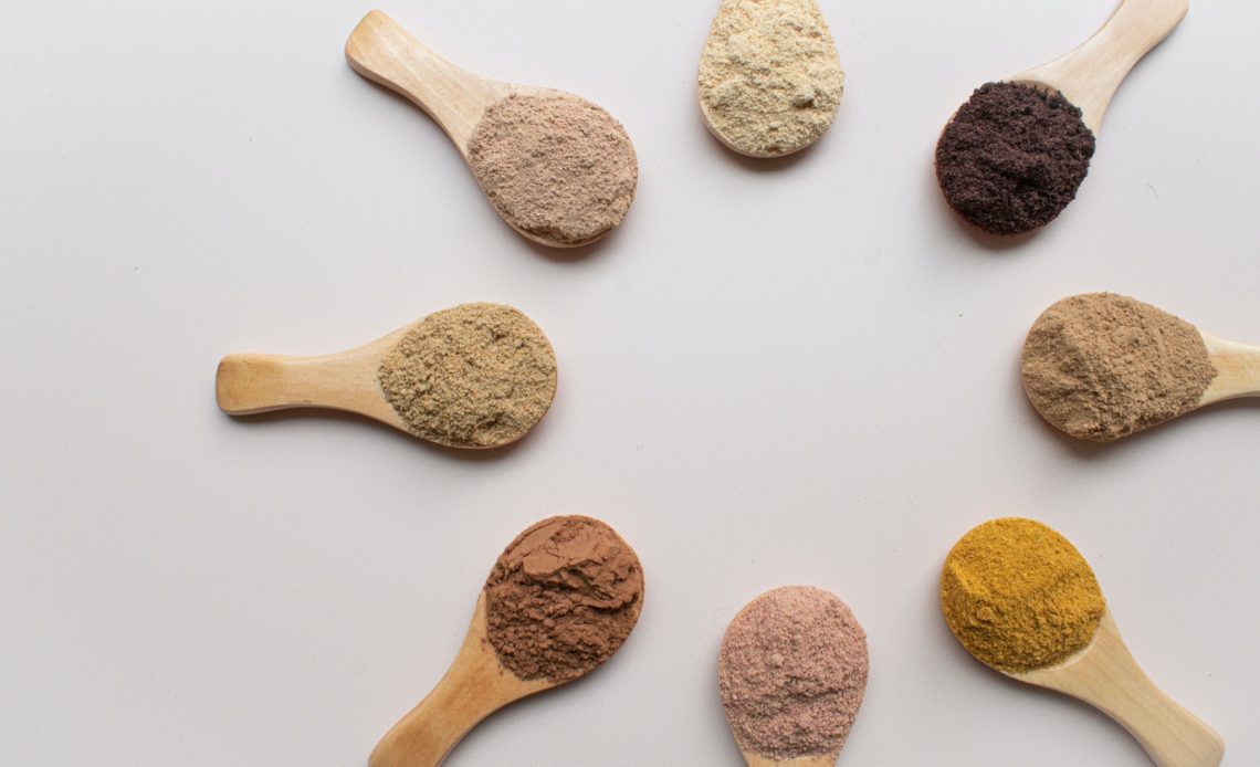 different types of powders in spoons